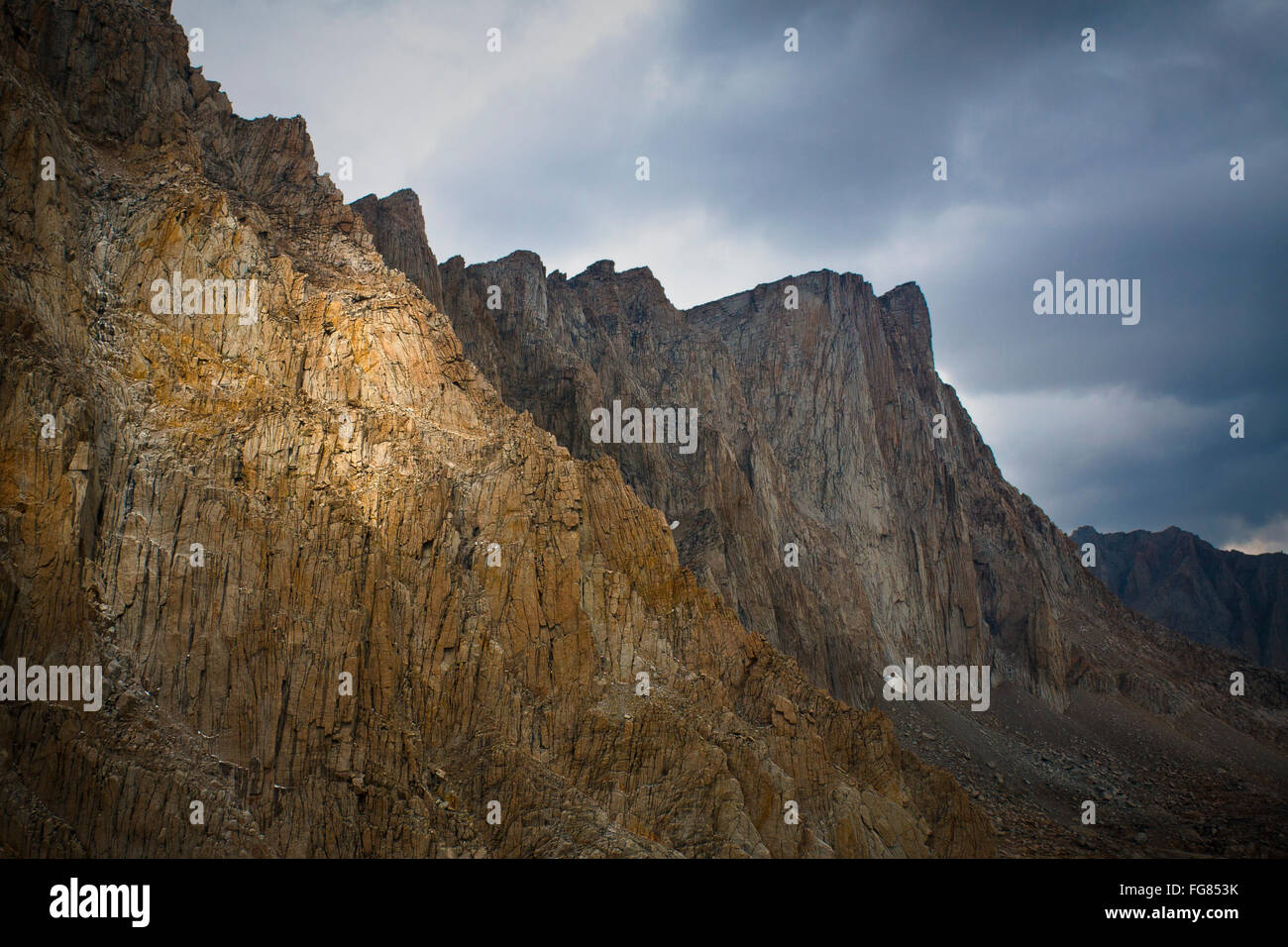 Low Angle View Of Mount Whitney Against Cloudy Sky Stock Photo
