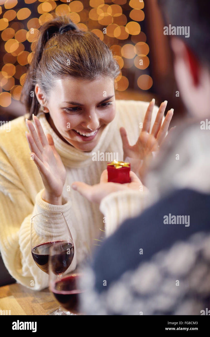 young man gives a gift to girl Stock Photo Alamy