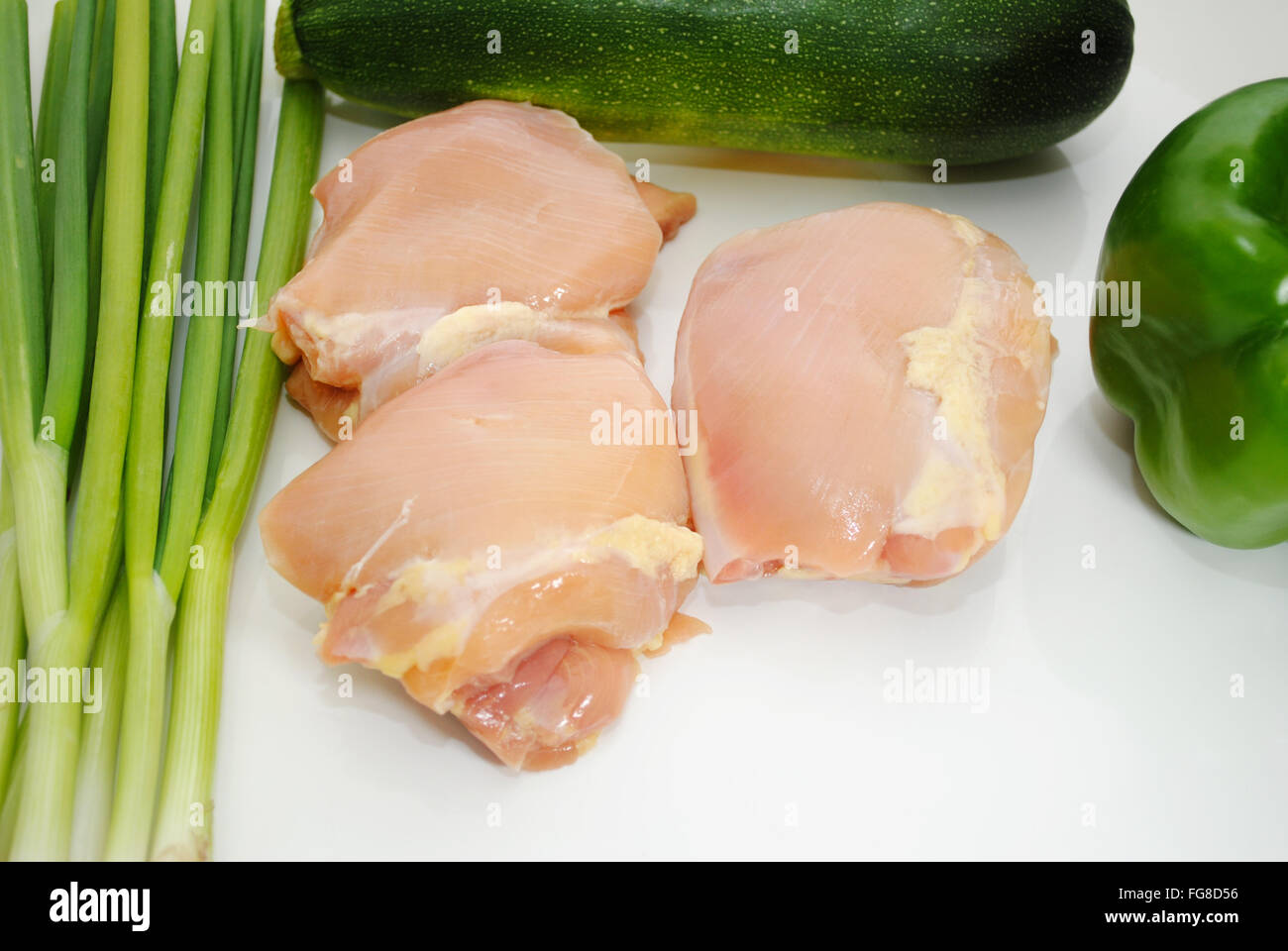 Boneless Chicken Thighs with Fresh Green Vegetables Stock Photo Alamy