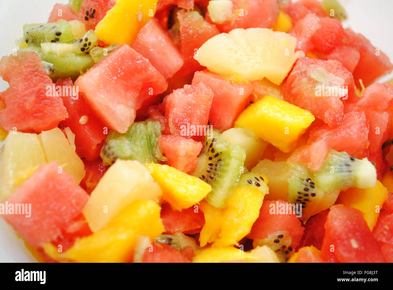 Tropical Fruit Salad with Melon, Mango, Kiwi and Pineapple Stock Photo