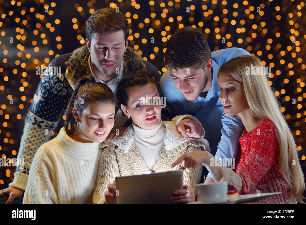 happy people looking at a tablet computer Stock Photo