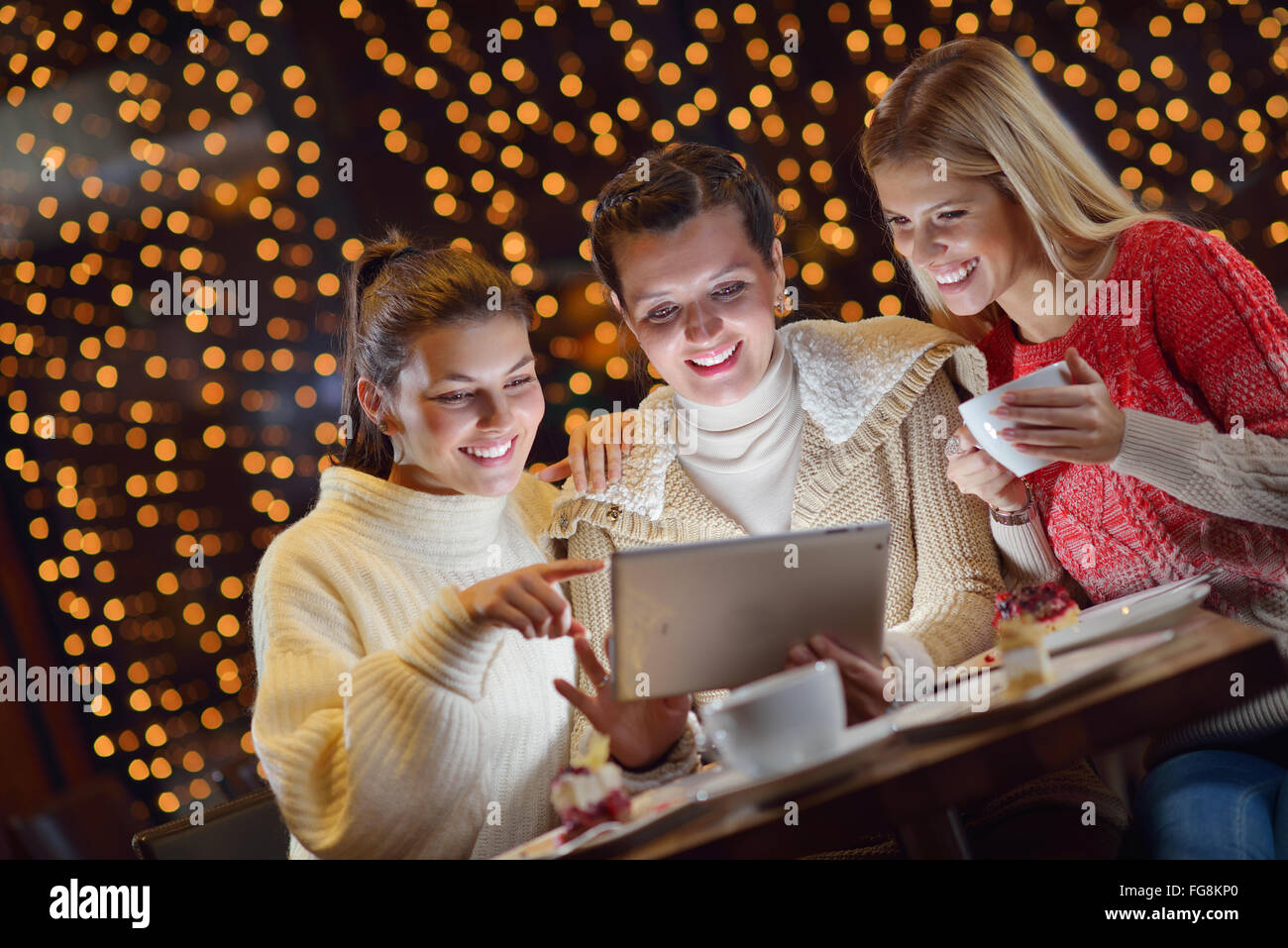 happy girls group looking at a pc tablet Stock Photo - Alamy