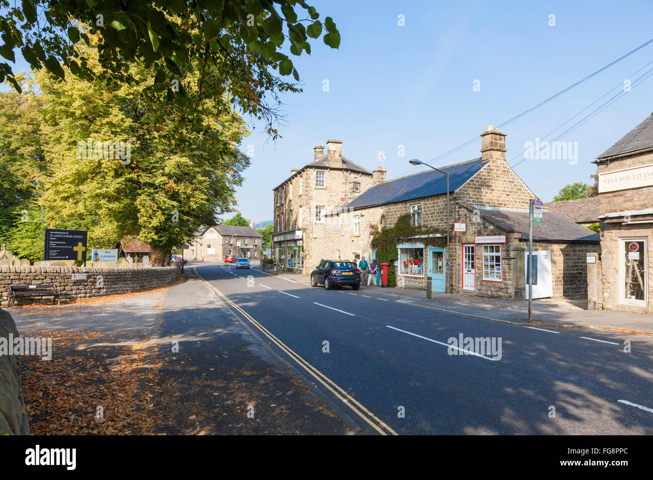 The main road (A623) through the village of Baslow, Derbyshire, Peak District National Park, England, UK Stock Photo