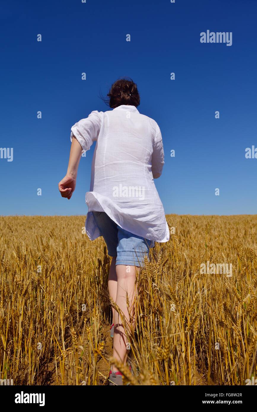 young woman in wheat field at summer Stock Photo - Alamy