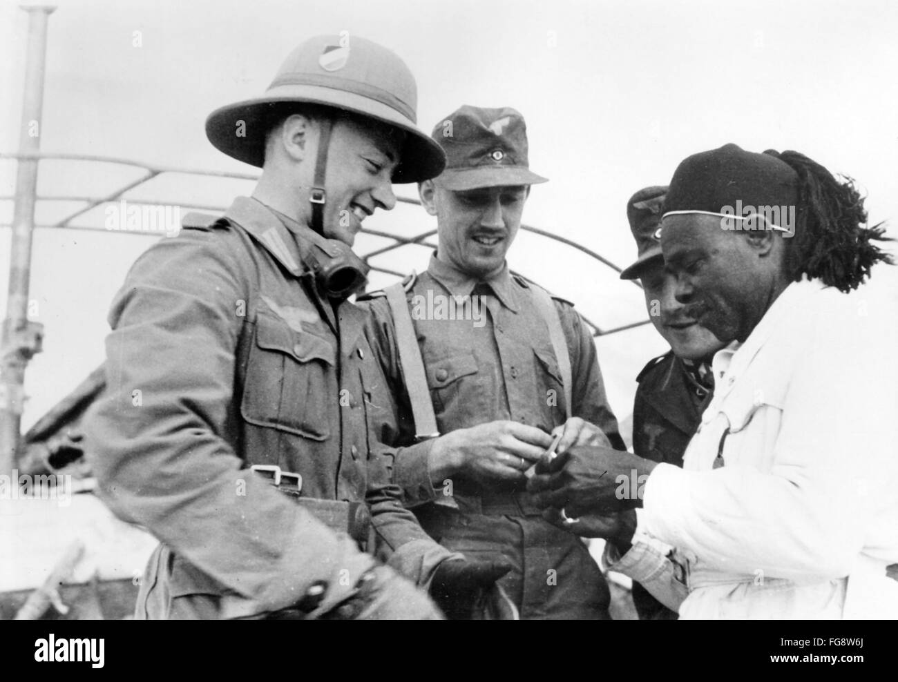 The Nazi propaganda image shows soldiers of the German Wehrmacht and locals in Libya. The photo was taken in March 1941. Fotoarchiv für Zeitgeschichte - NO WIRE SERVICE - Stock Photo