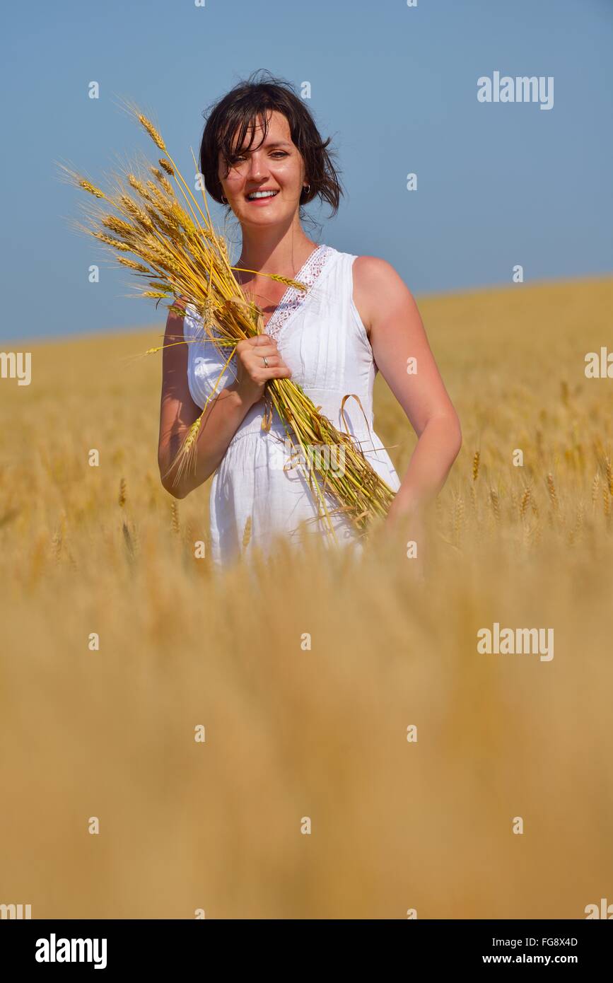young woman in wheat field at summer Stock Photo - Alamy