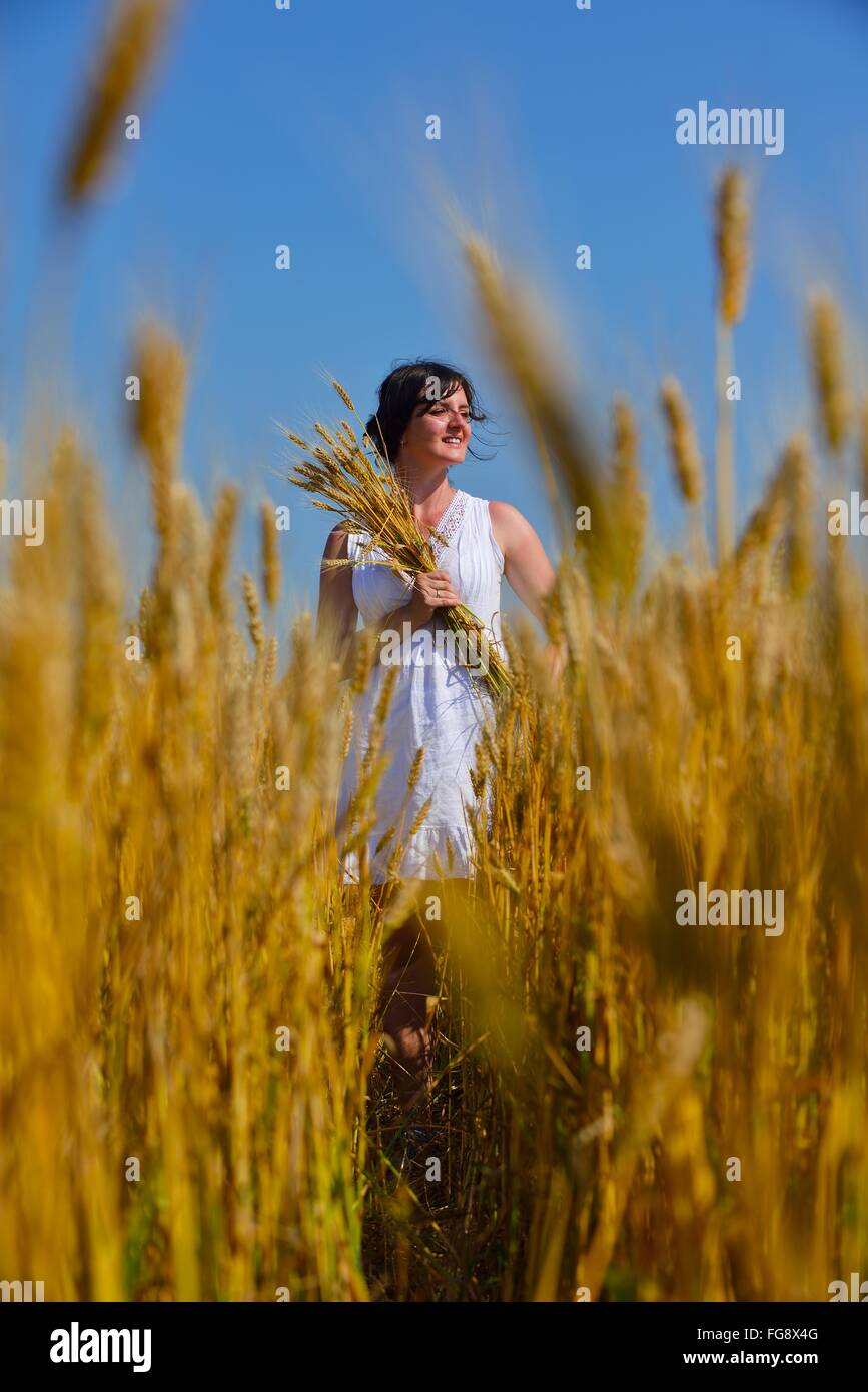 young woman in wheat field at summer Stock Photo - Alamy