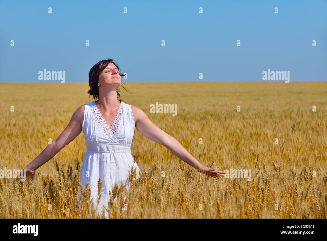 young woman in wheat field at summer Stock Photo - Alamy