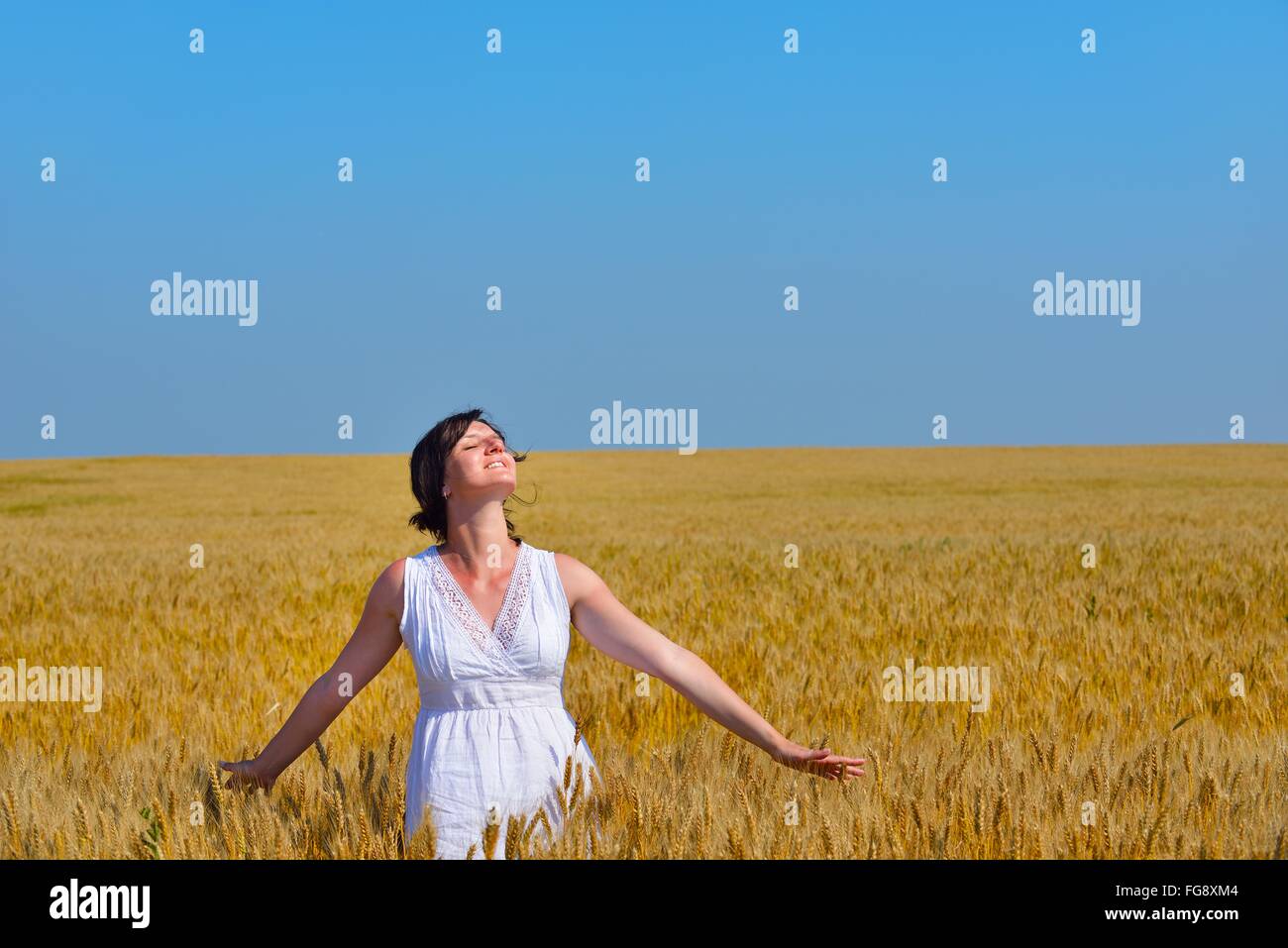 young woman in wheat field at summer Stock Photo - Alamy