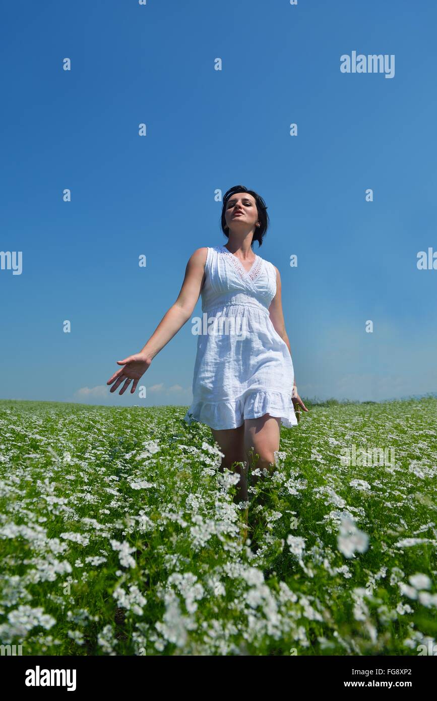Young happy woman in green field Stock Photo - Alamy