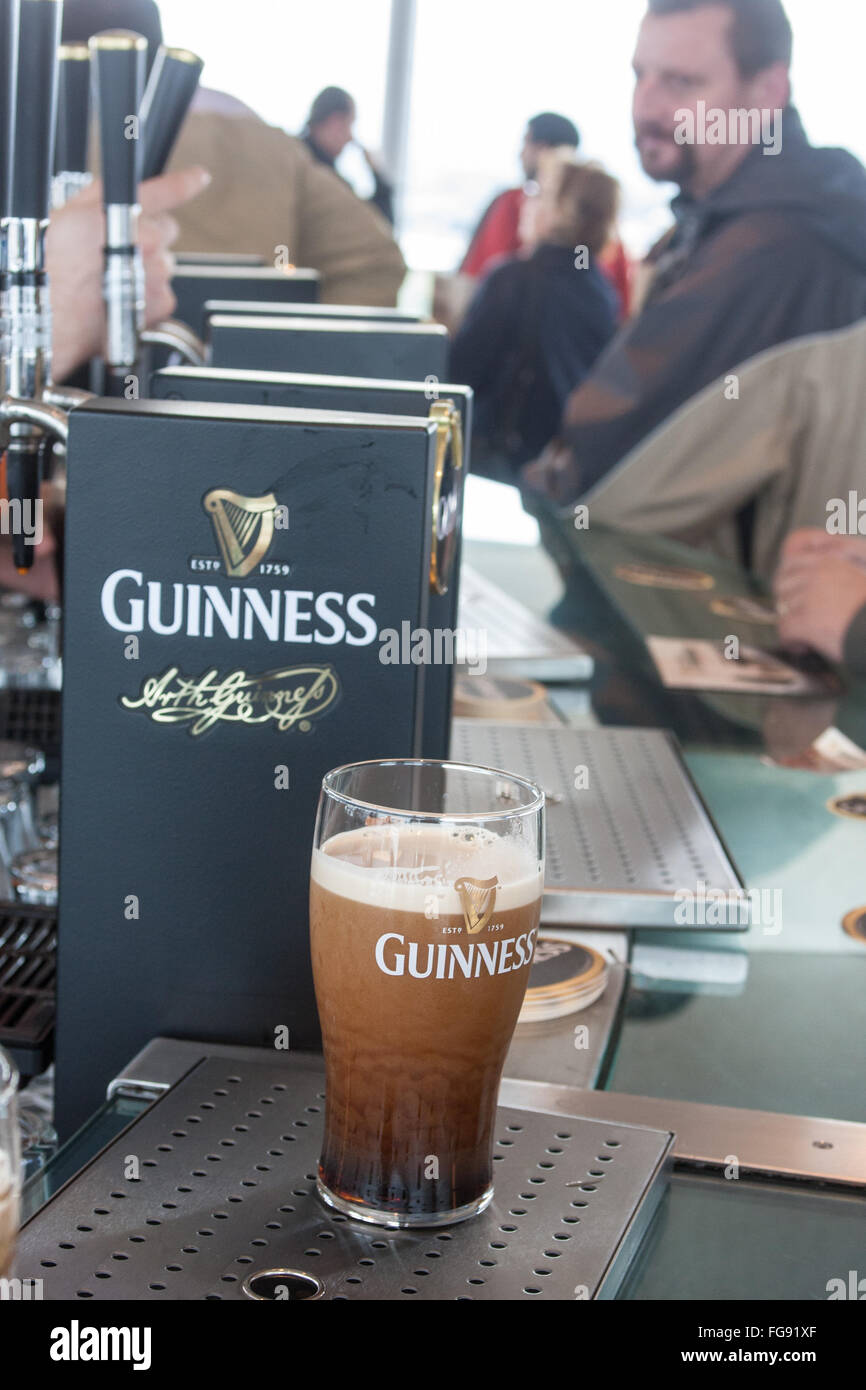 drink,drinking,alcohol,having,a,pint,pint,pints,of,Guinness,at,Interior of old, Guinness,Storehouse,circular,Gravity Bar,Dublin,Ireland.,St Patrick's Stock Photo