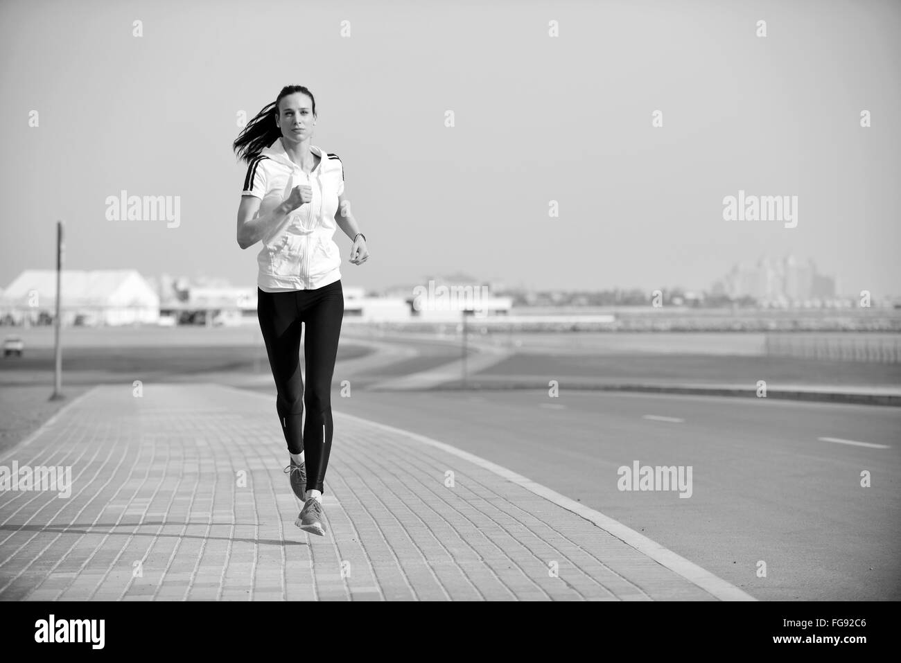 Young person jogging Black and White Stock Photos & Images Alamy