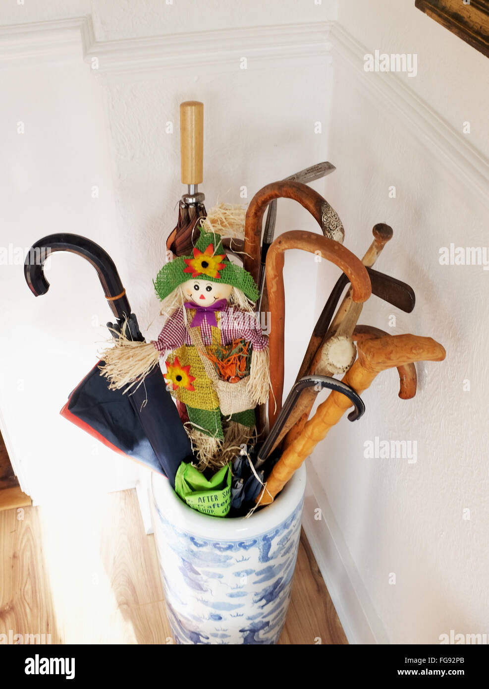 Walking sticks in a container in porch of a home Stock Photo