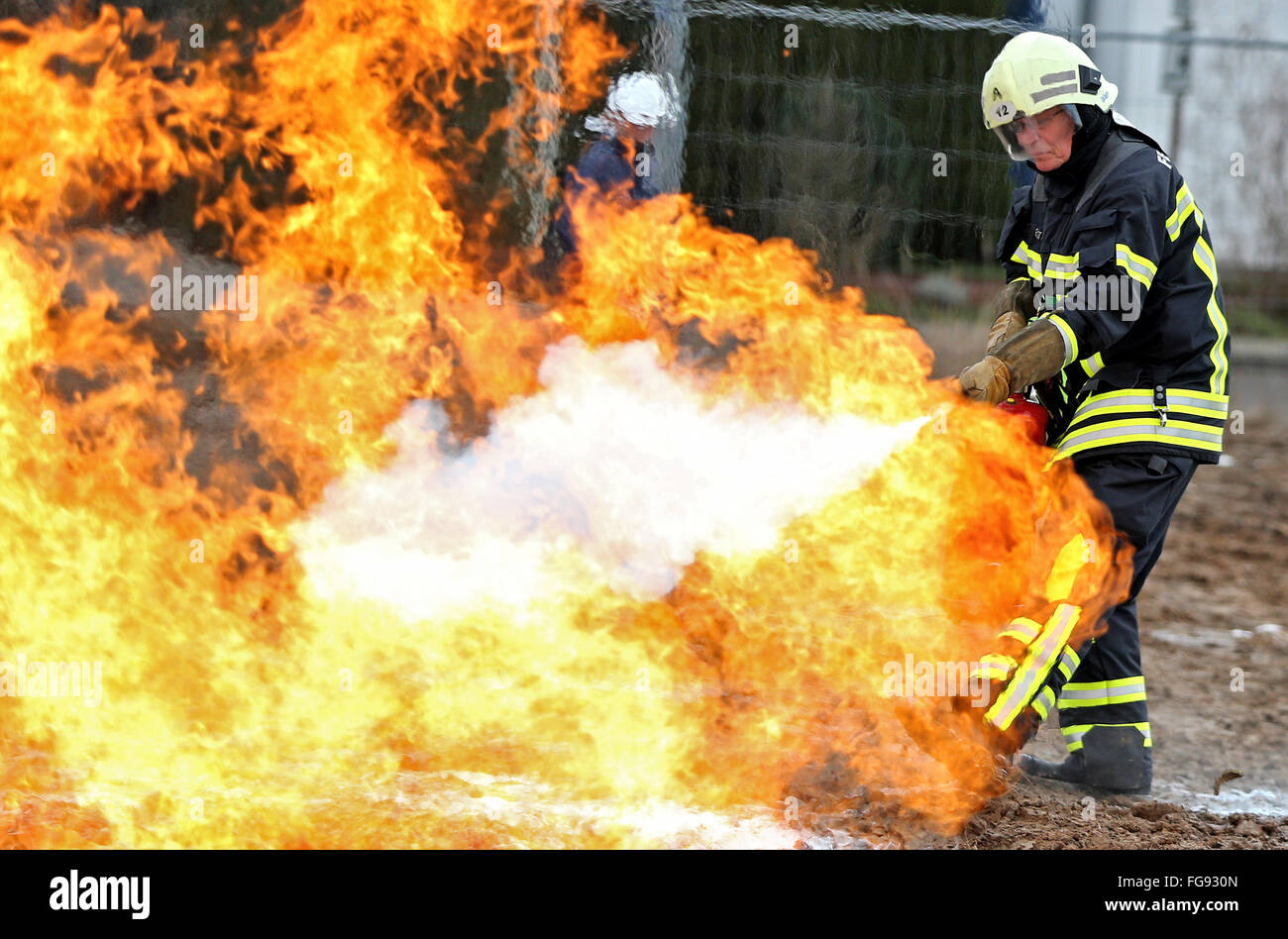 A firefighter puts out a burning gas line during training drills in Leipzig, Germany, 18 February 2016. Netz Leipzig GmbH - responsible for the gas grid in the Leipzig municipal works - drilled an accident on their 1,000km-long gas grid with the fire department. These drills are intended to help avoid catastrophes like the gas explosion in 23 October 2014 in Ludwigshafen, in which two people were killed and a tram was destroyed. Photo: JAN WOITAS/dpa Stock Photo