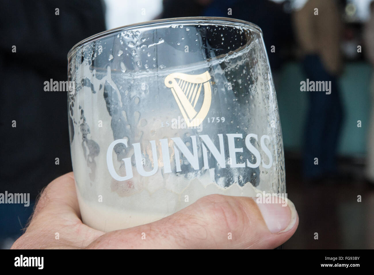 drink,drinking,having,a,pint,alcohol,pint,pints,of,Guinness,at,Interior of old, Guinness,Storehouse,circular,Gravity Bar,Dublin,Ireland.,St Patrick's Stock Photo