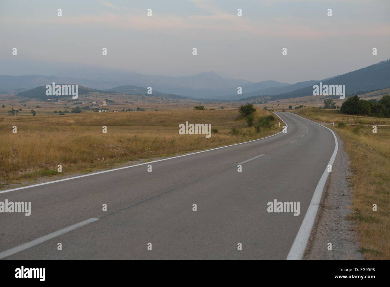 road through the green field Stock Photo - Alamy