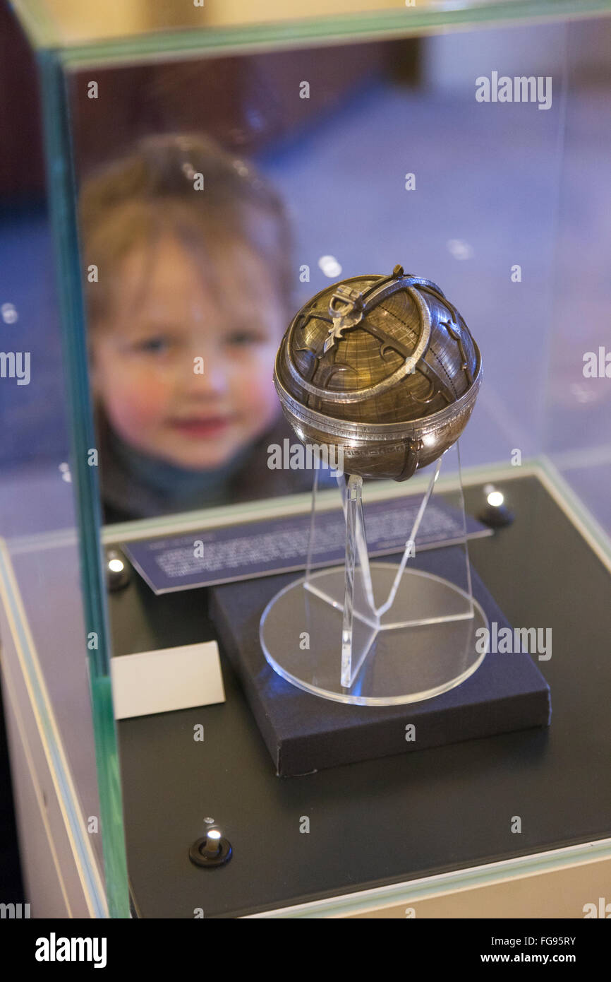 Young school age girl looking at display exhibit exhibition. Museum of the History of Science
