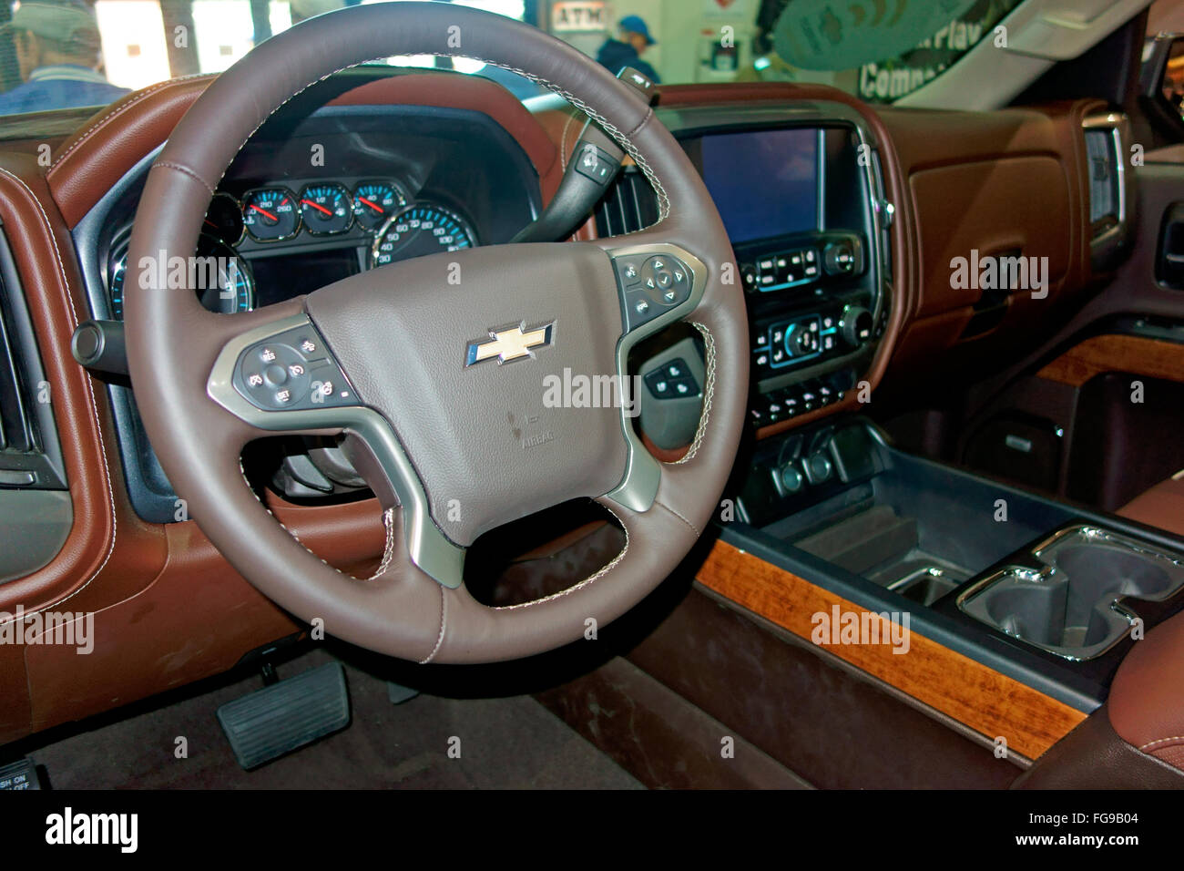 The dash, steering wheel and instruments of a 2016 GMC Chevrolet Chevy silverado 1500 truck automobile Stock Photo