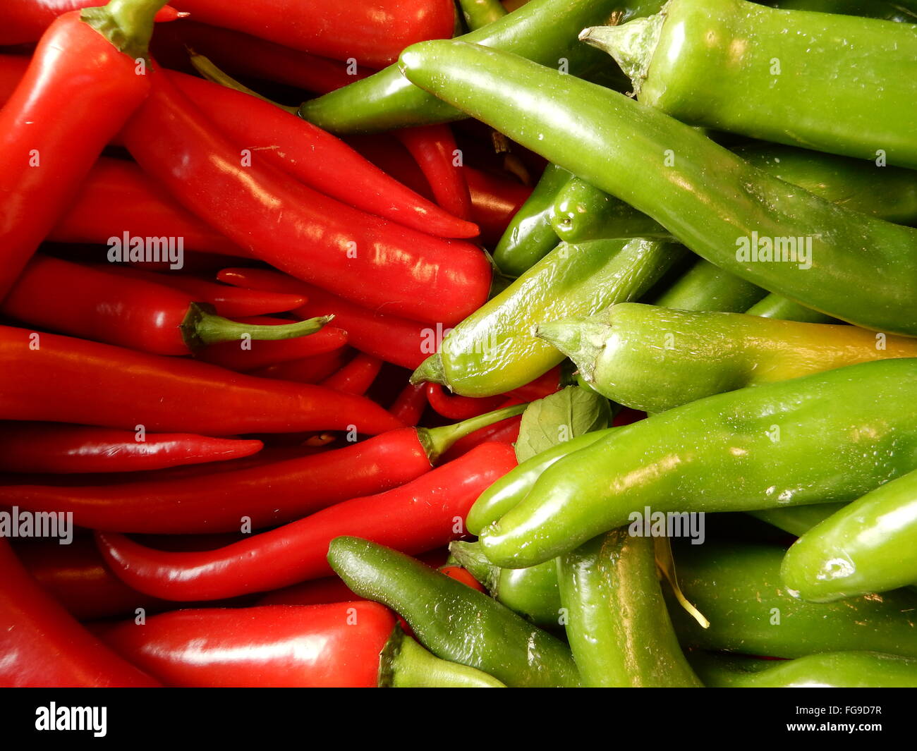 red and green Chili Peppers on the market place in Bonn, Germany Stock Photo