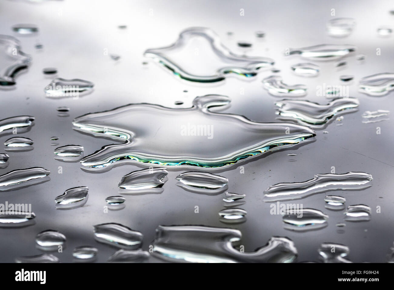 Close-Up Of Spilled Water On Glass Table Stock Photo - Alamy