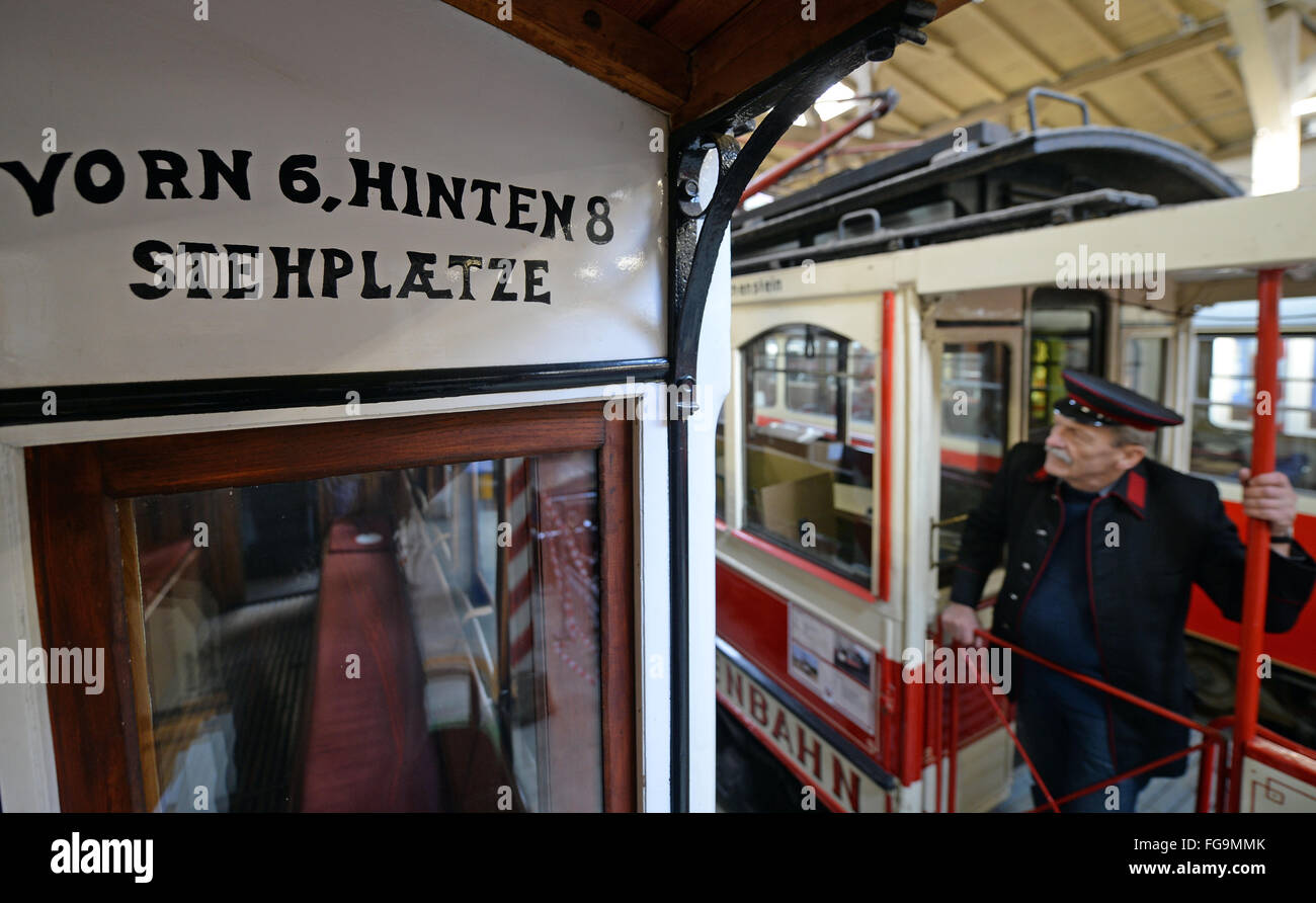 Harald Mey standing in a historical railcar of the MAN machine works Augsburg from 1911 in the tram museum in Halle, Germany, 18 February 2016. Halle is known as a pioneering city in the tram history with the first electrical tram network in Europe, having been erected in 1891. In the central station, the exhibition '125 Jahre elektrisiert durch Halle (Saale)' (lit. '125 years electrified through Halle') is opening tonight. PHOTO: HENDRICK SCHMIDT/dpa Stock Photo