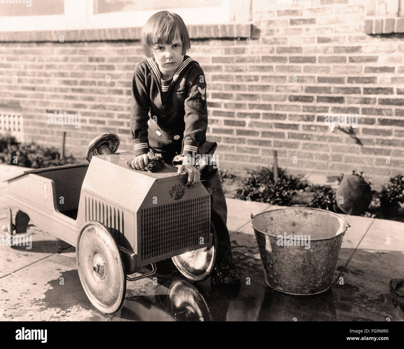vintage pedal car in the early XX th century Stock Photo