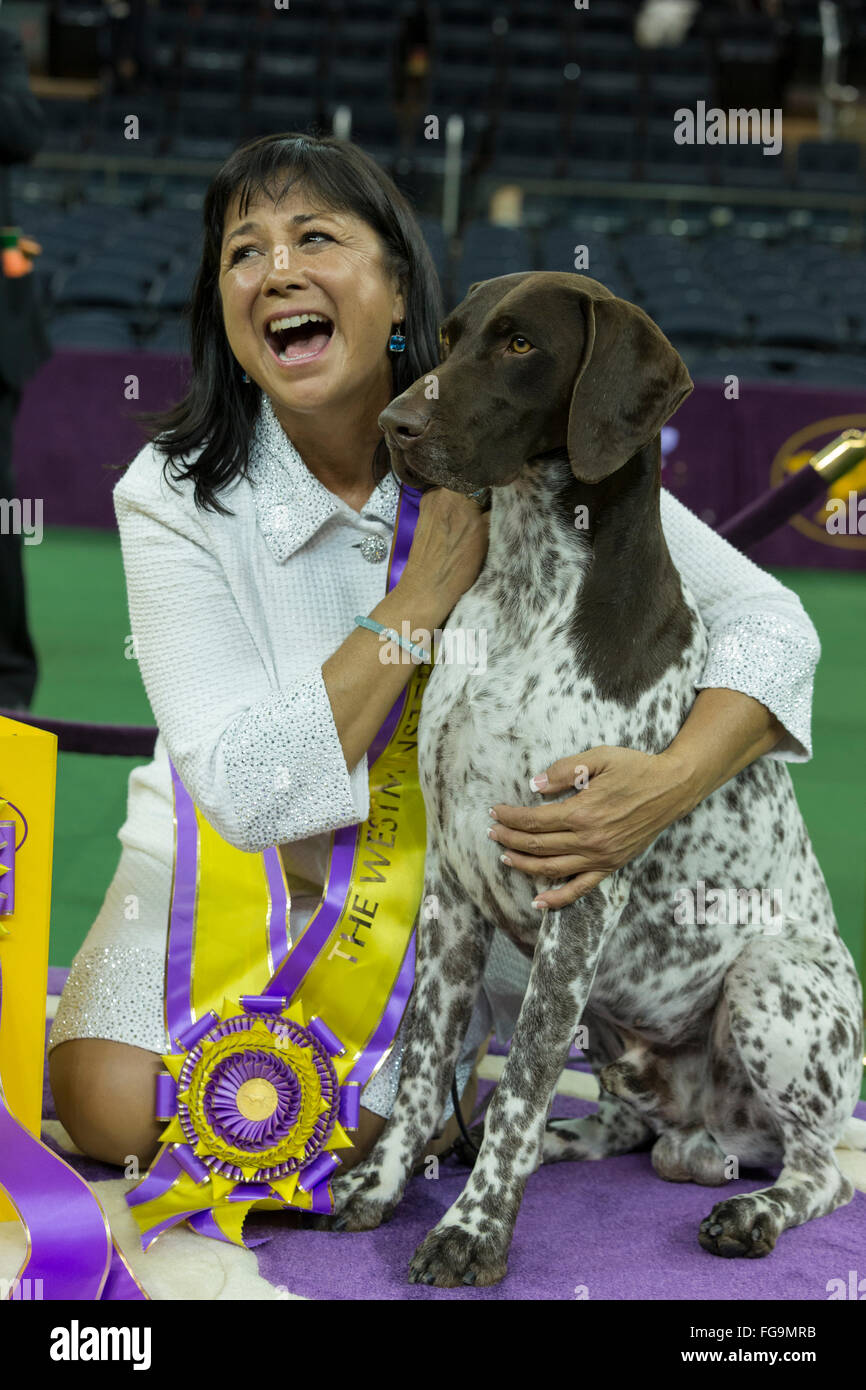 New York, NY - February 16, 2016: Best of Show German shorthaired pointer poses with handler Valerie Nunes-Atkinson at 140 Westminster Kennel Club dog show at Madison Square Garden Stock Photo