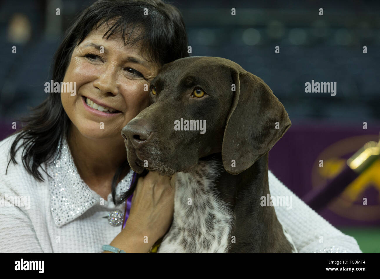 New York, NY - February 16, 2016: Best of Show German shorthaired pointer poses with handler Valerie Nunes-Atkinson at 140 Westminster Kennel Club dog show at Madison Square Garden Stock Photo