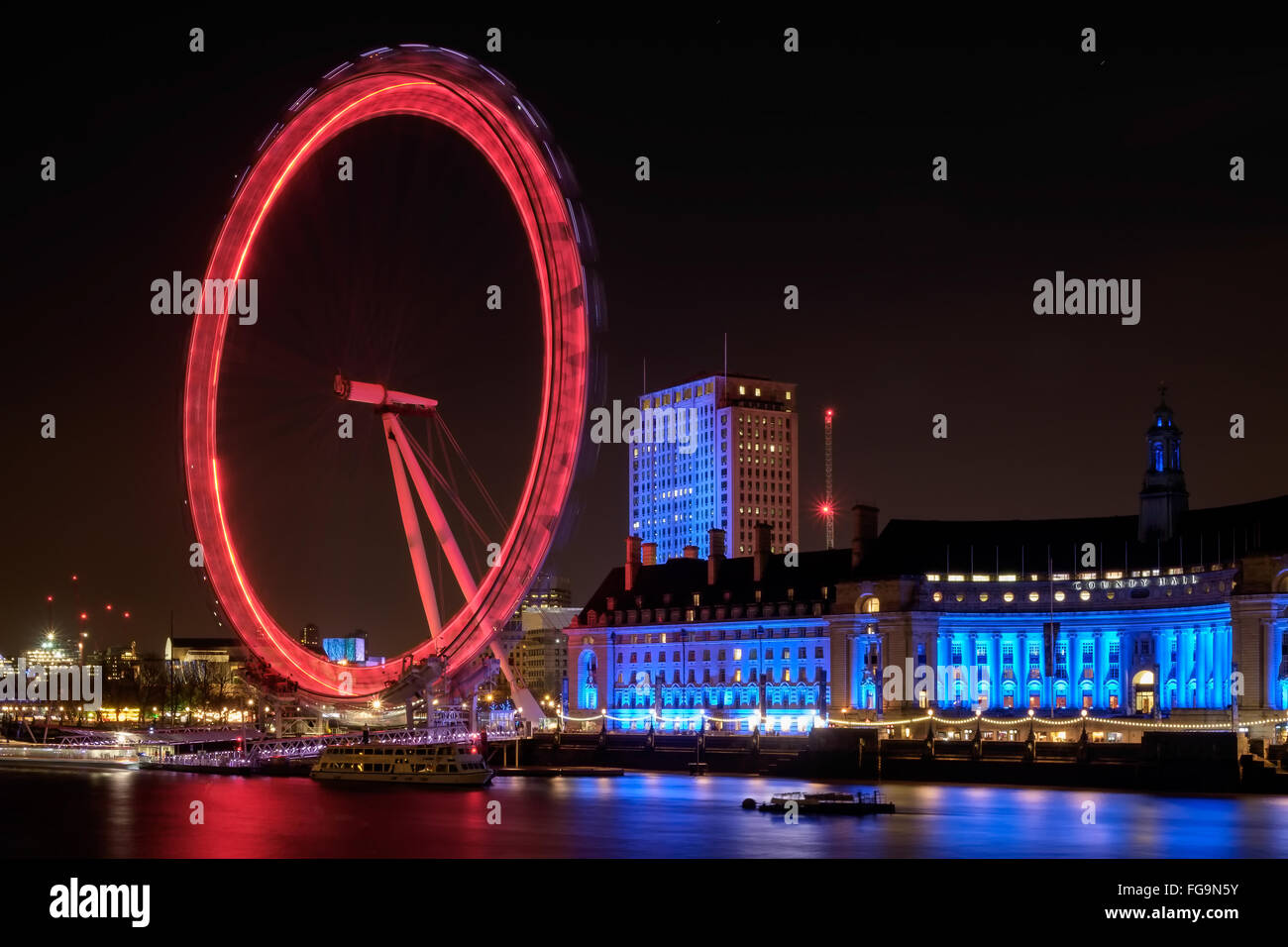View of the London Eye at Night Stock Photo