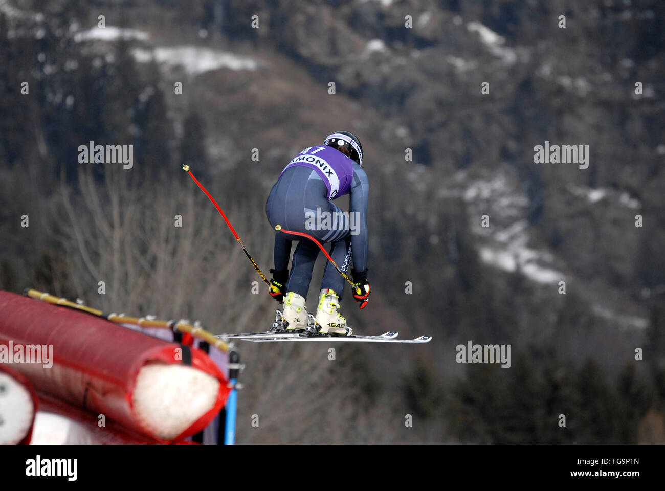 Mens downhill ski racer in the air Stock Photo