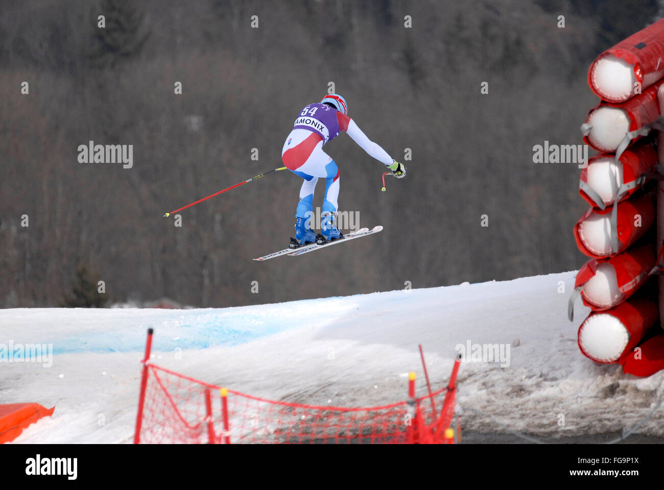 Mens downhill ski racer in the air Stock Photo
