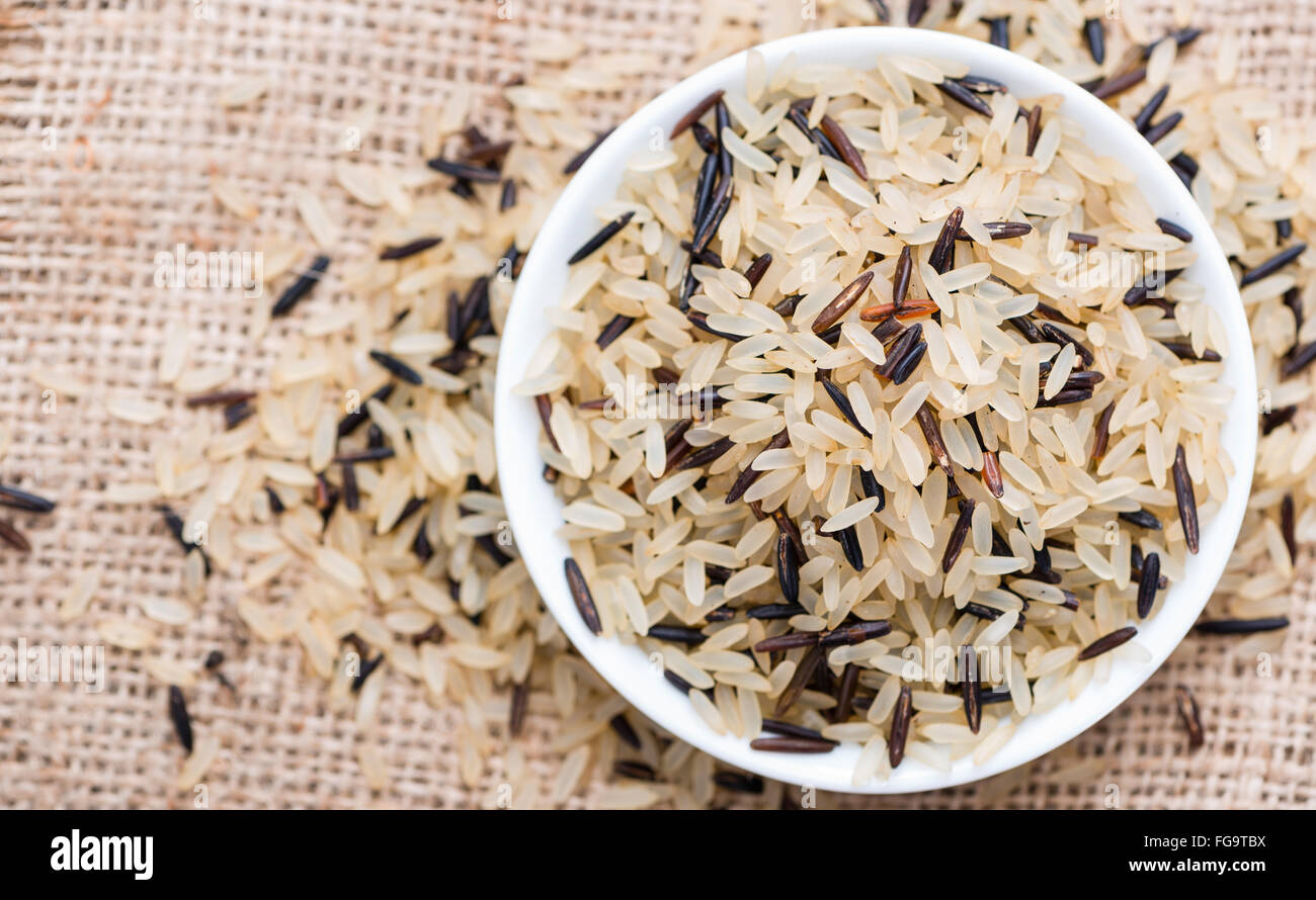 Uncooked Rice (mixed with wild Rice) on rustic background Stock Photo ...