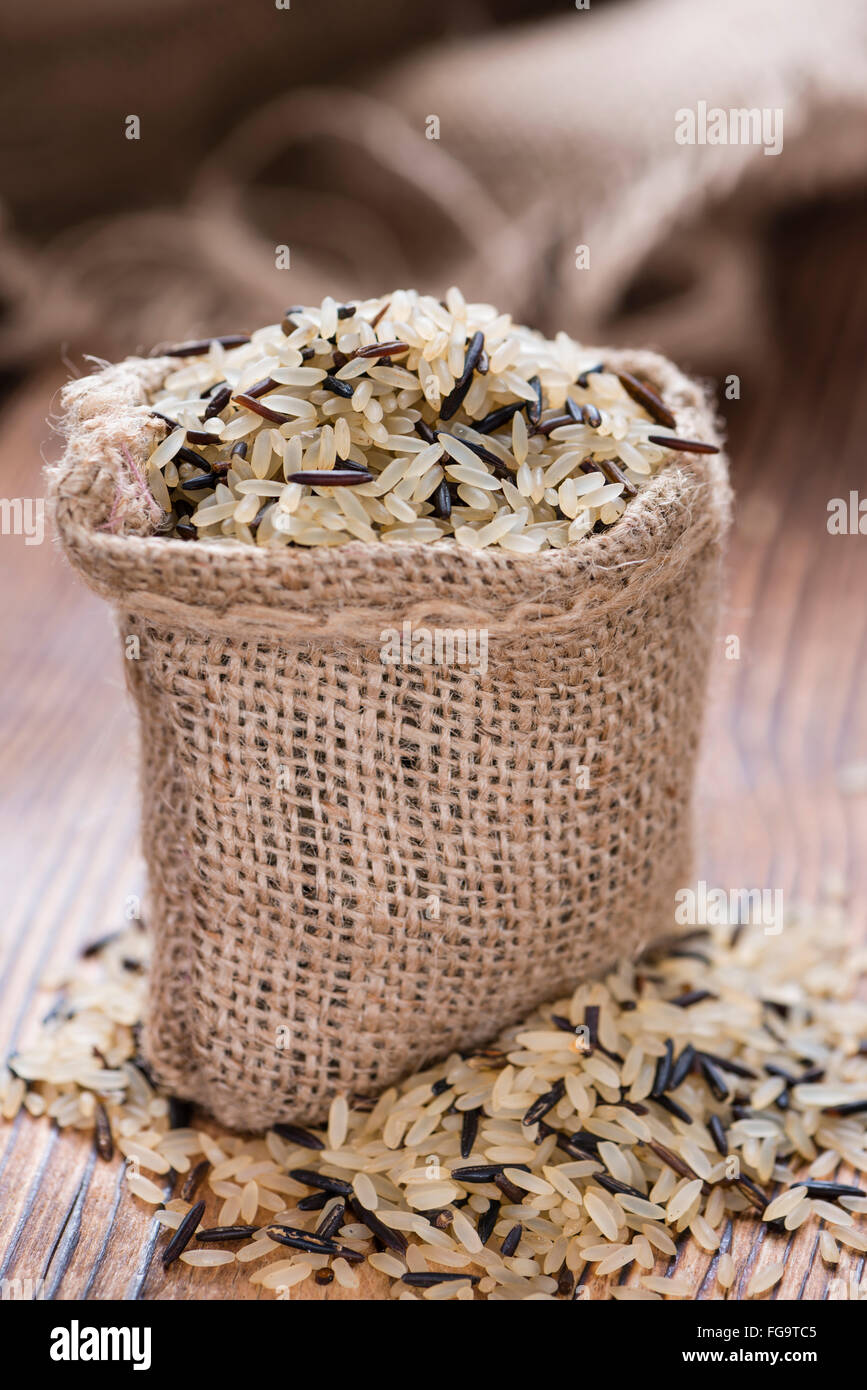 Uncooked Rice (mixed with wild Rice) on rustic background Stock Photo ...
