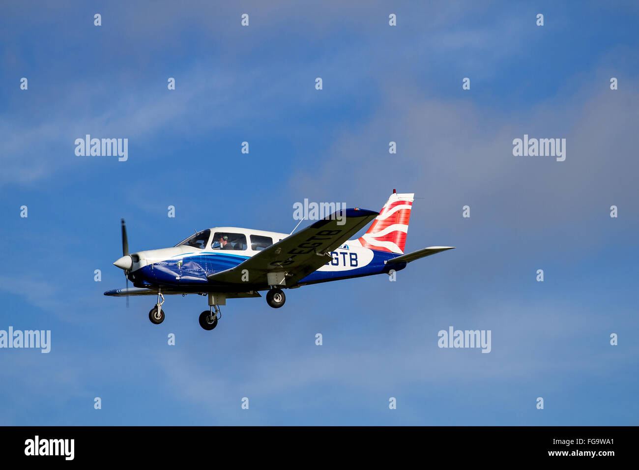 Tayside Aviation Piper PA-28-161 Warrior II G-EGTB aircraft flying overhead while preparing to land at the airport in Dundee, UK Stock Photo