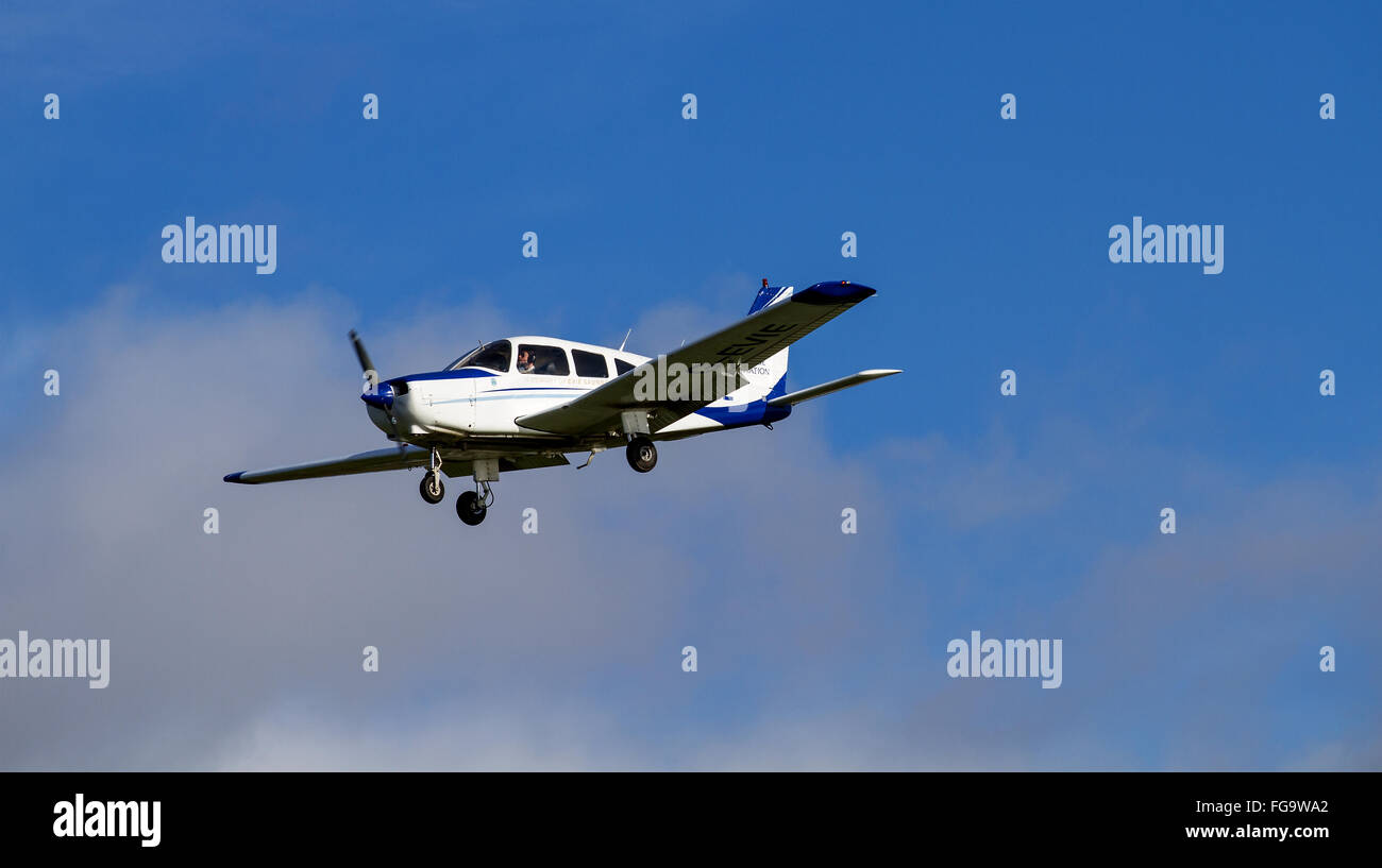 Tayside Aviation Piper PA-28 Warrior G-EVIE light monoplane preparing to land at the airport in Dundee, UK Stock Photo