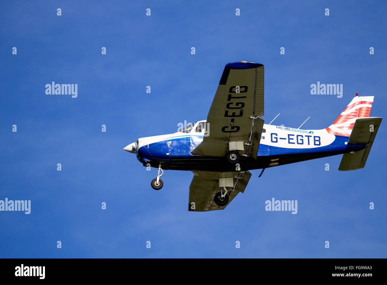 Tayside Aviation Piper PA-28-161 Warrior II G-EGTB aircraft flying overhead while preparing to land at the airport in Dundee, UK Stock Photo