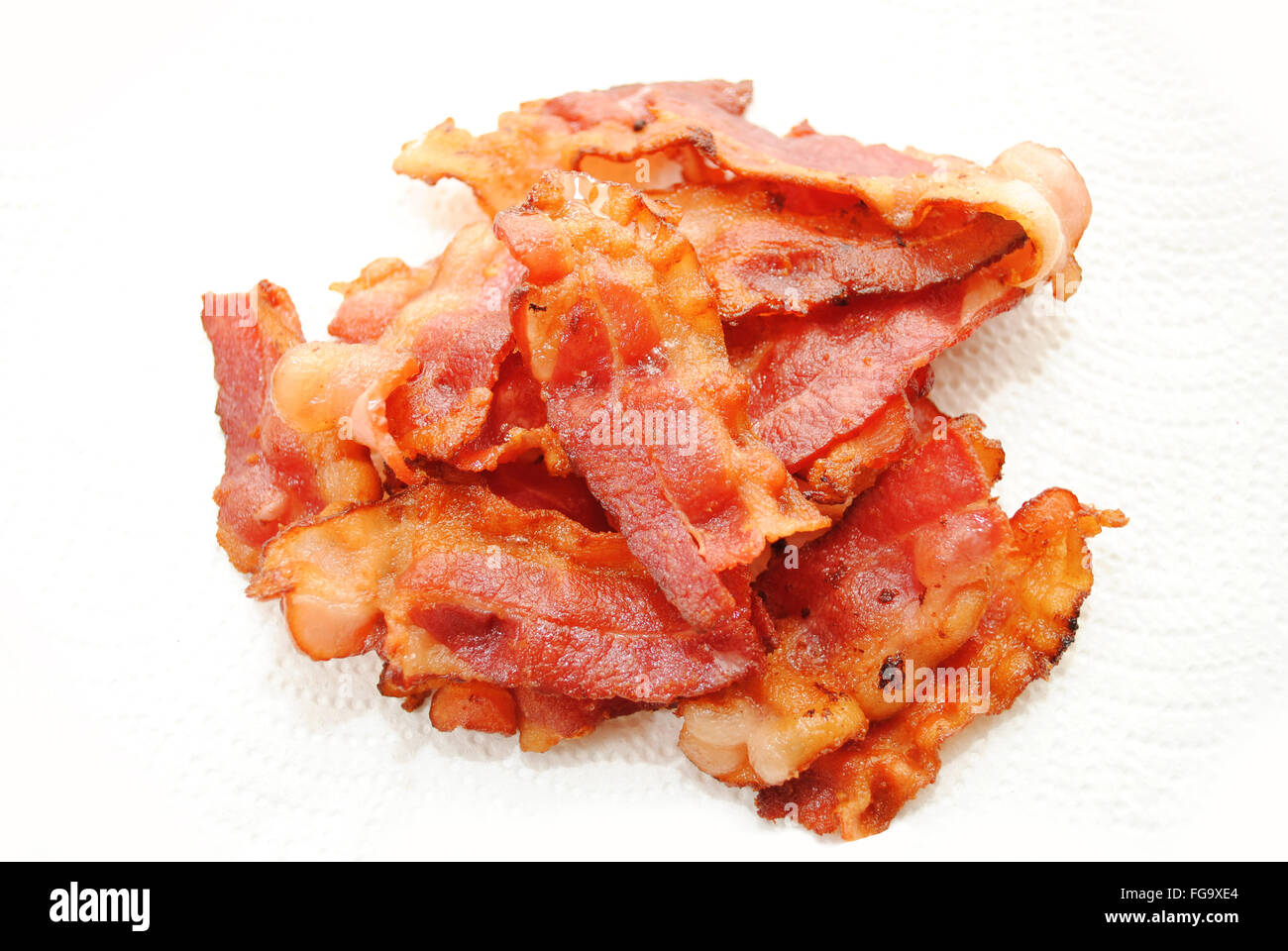 Crispy Fried Bacon Drying on Paper Towel Stock Photo