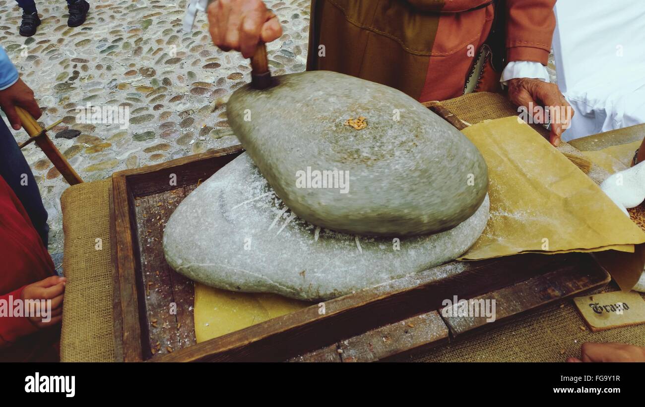 Midsection Of Man Smoothing Rocks Stock Photo