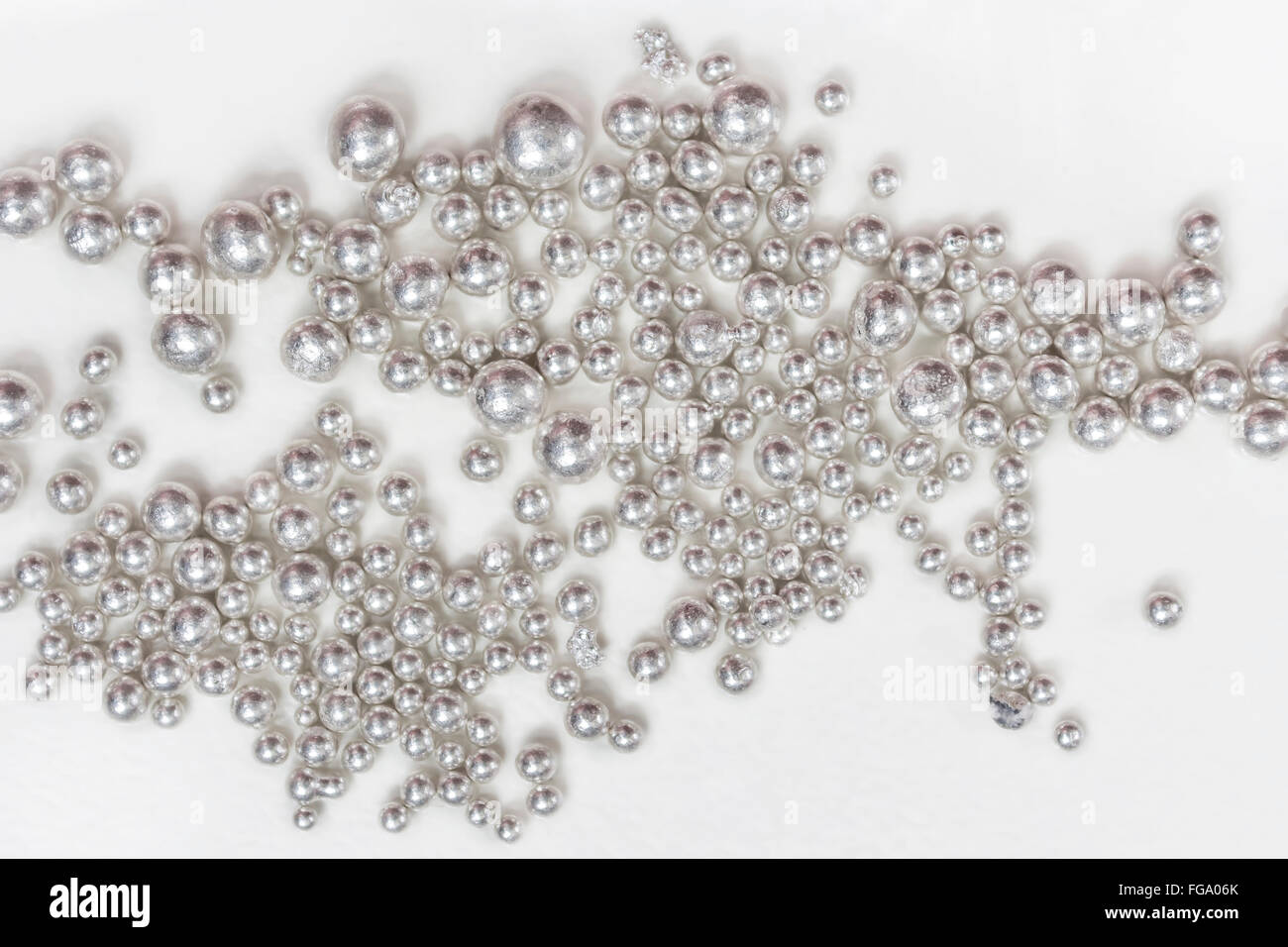 Pure silver granules on a white background Stock Photo
