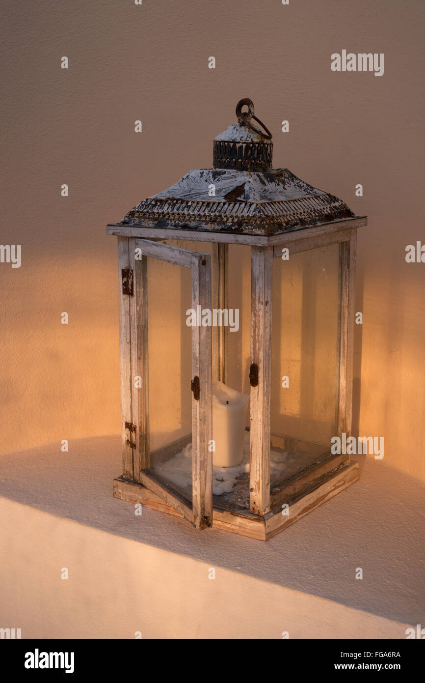Candle In Lantern Against Wall Stock Photo Alamy