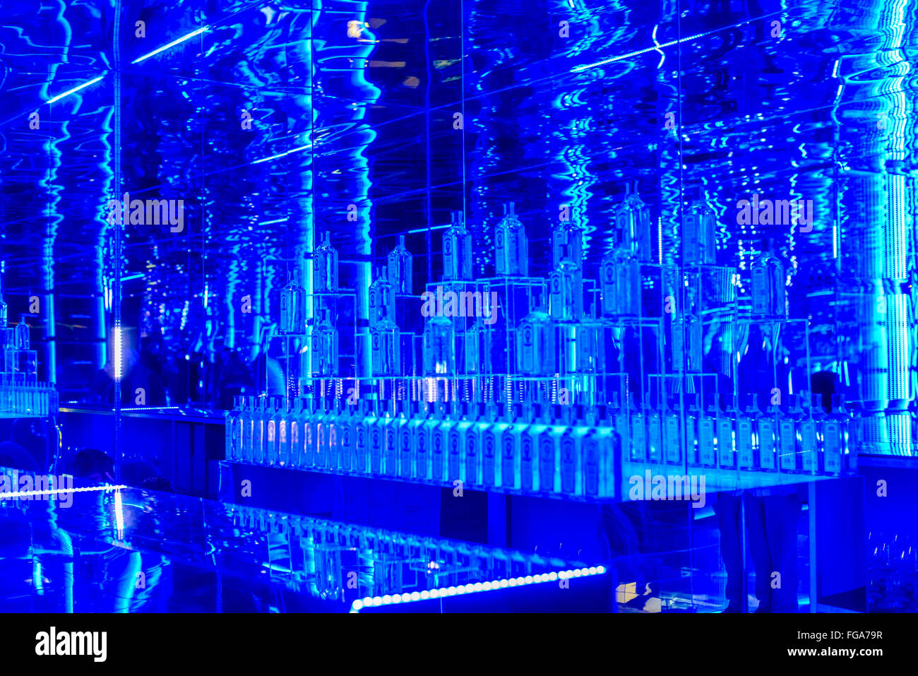 18th February 2016 Madrid, Spain. An empty bar section in The Art Room. The Bombay Sapphire have designed the MBFW 2016 Madrid kissing room with a spacious blue themed mirror surround hall, #TheatreRoom,  and The Art Room, with large LED screen that reflects the movements of people using Wii type technology at MBFW 2016 Madrid, Spain. © Lawrence JC Baron/Alamy Live News. Stock Photo