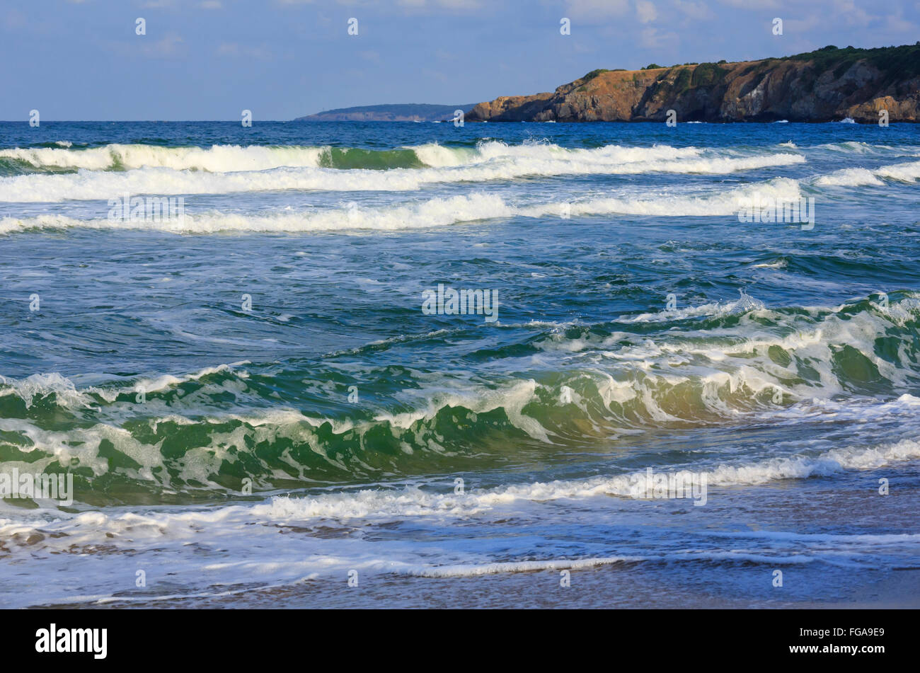 Wave of surf. Sea summer view from beach. Stock Photo