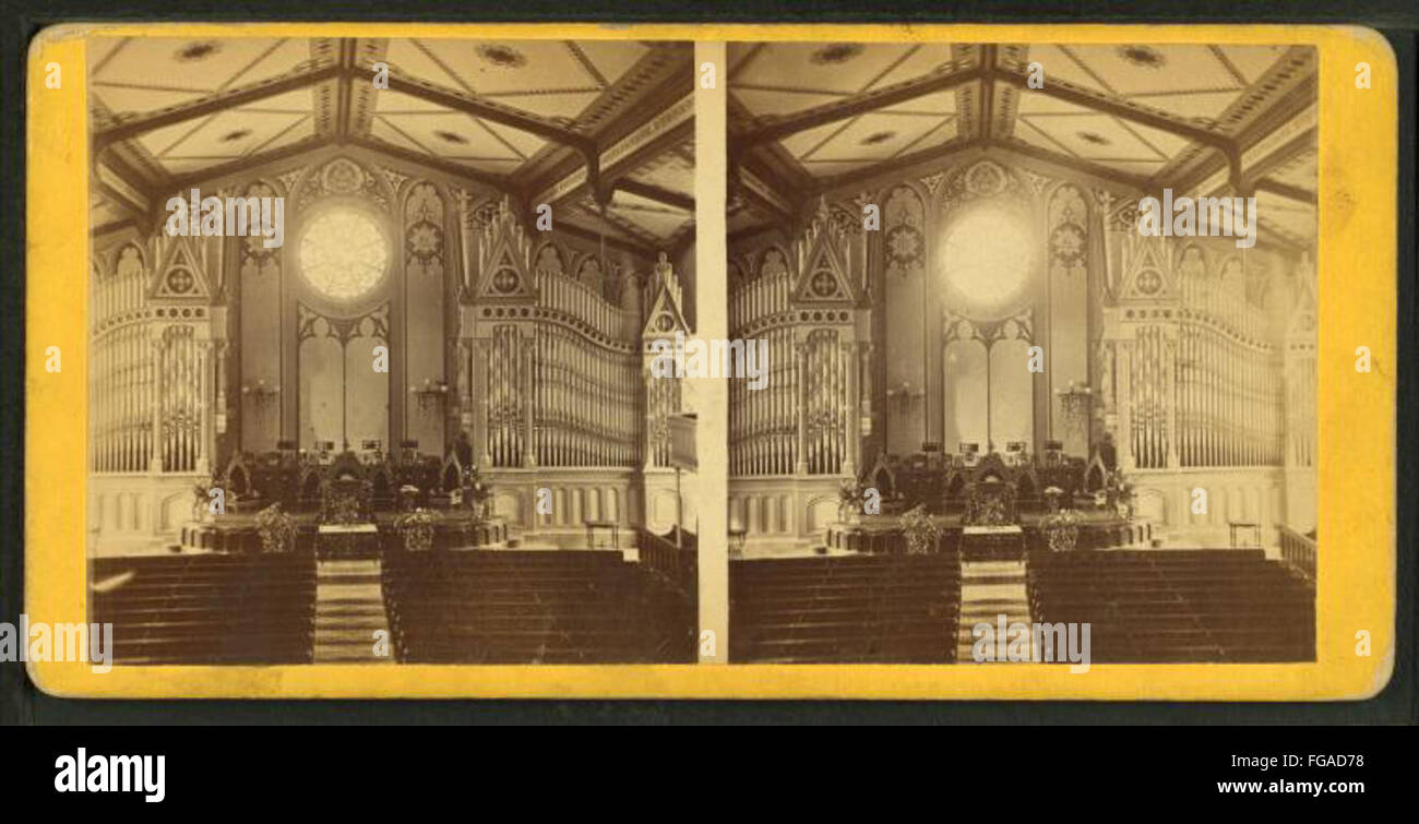 Interior of a church showing the altar, a large organ, and painted ceiling, by E. F. Gay Stock Photo