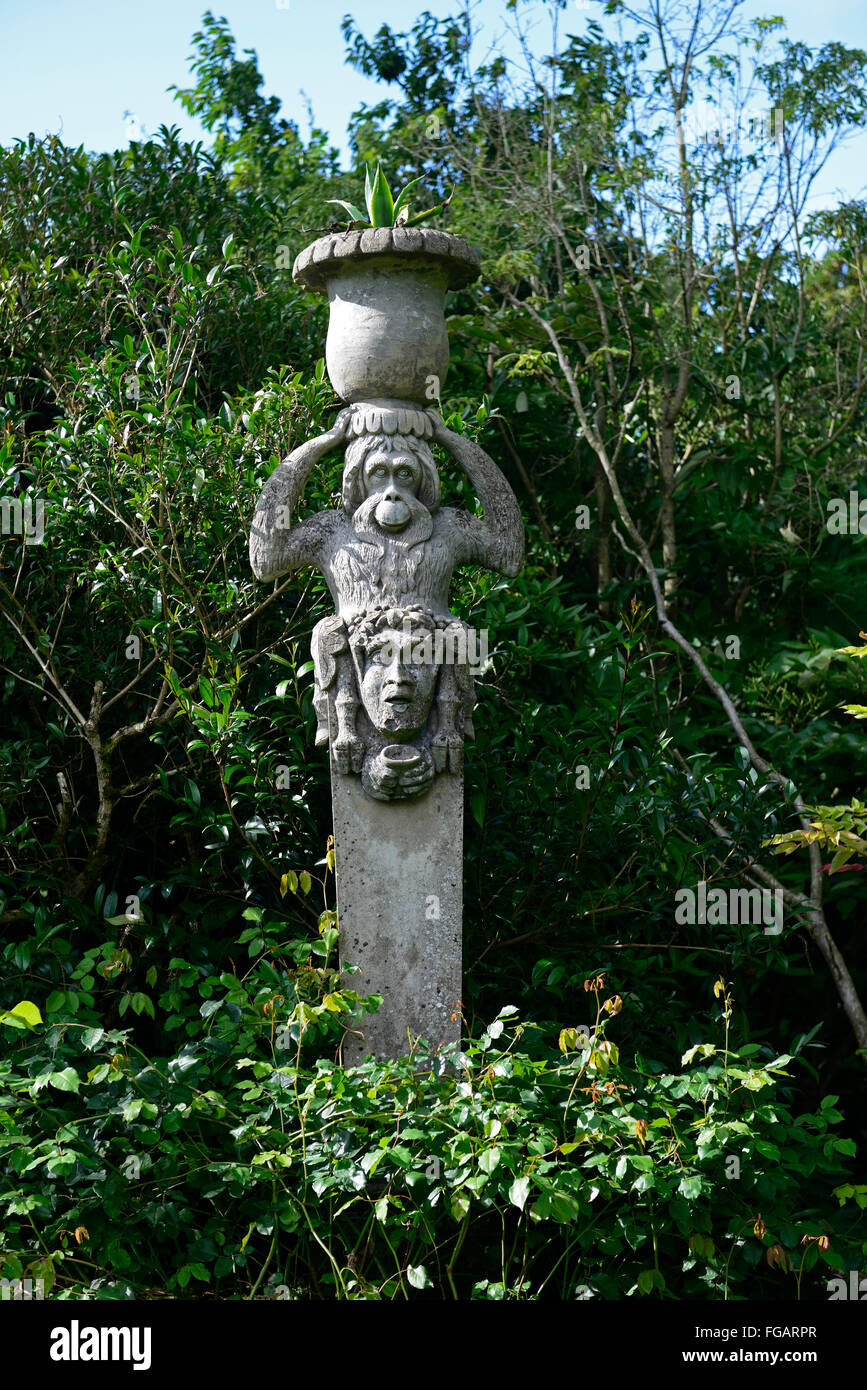 orangutan stone pillar totem pole mount stewart gardens gardening unusual garden art installation RM Floral Stock Photo