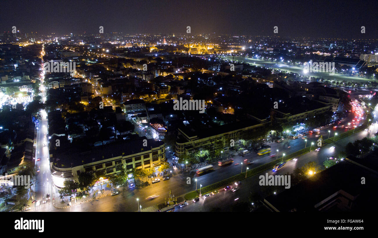 A aerial view of Ratchadamnoen Klang Road with the Grand Palace in the background, near Banglumpoo at night in Bangkok, Thailand. Stock Photo