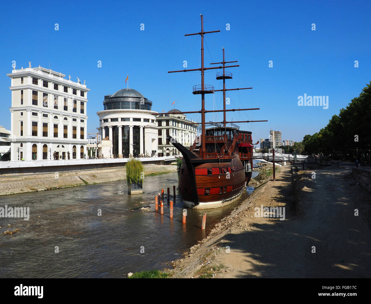 A large wooden sailing ship stranded on the shores of the river Vardar, turned into a restaurant. Stock Photo