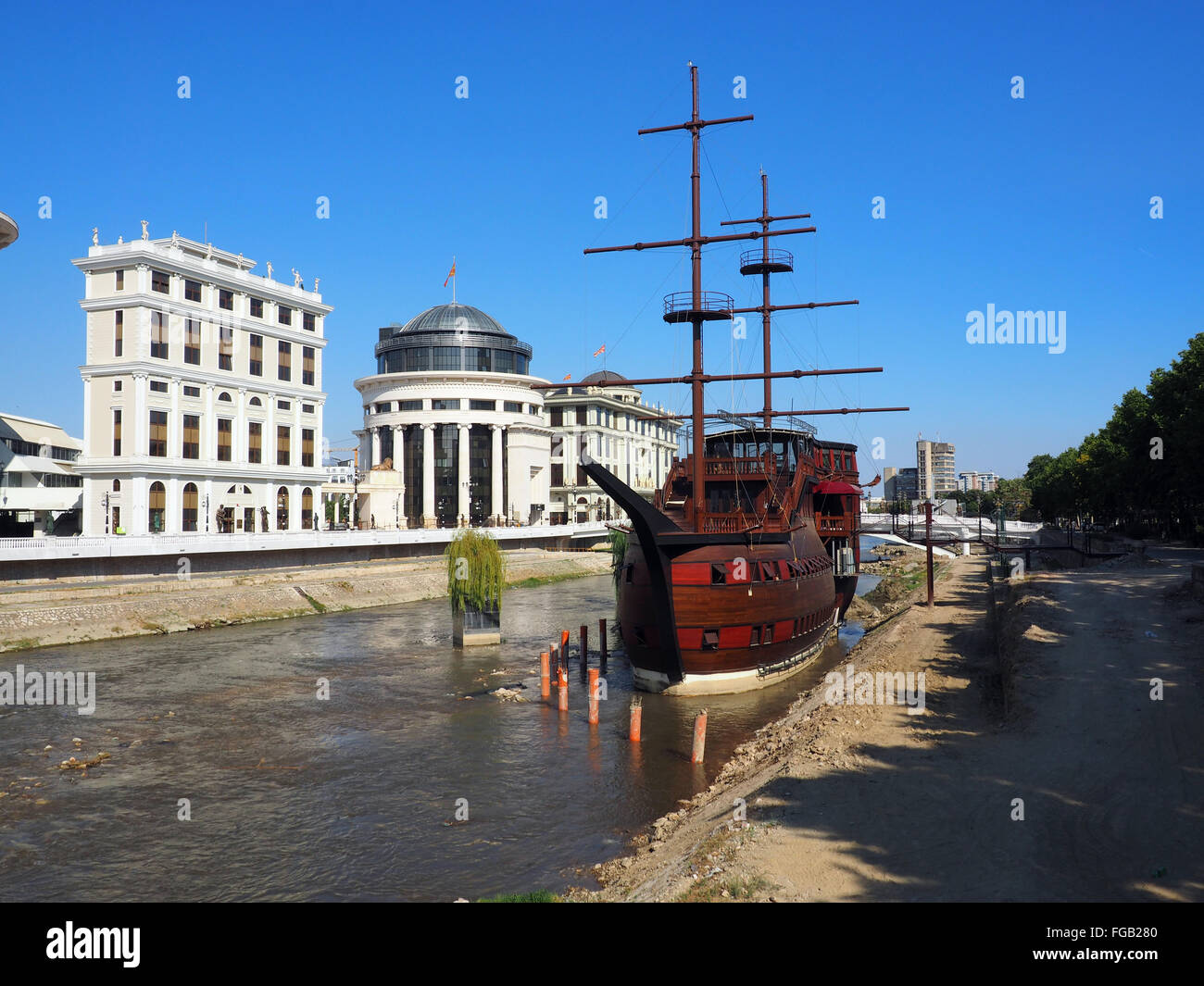 A large wooden sailing ship stranded on the shores of the river Vardar, turned into a restaurant. Stock Photo