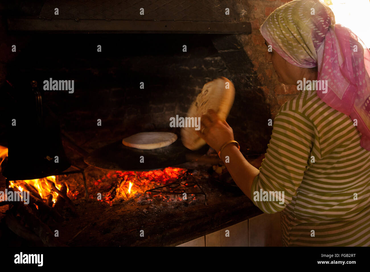 a-turkish-flat-bread-being-baked-on-an-open-fire-stock-photo-alamy
