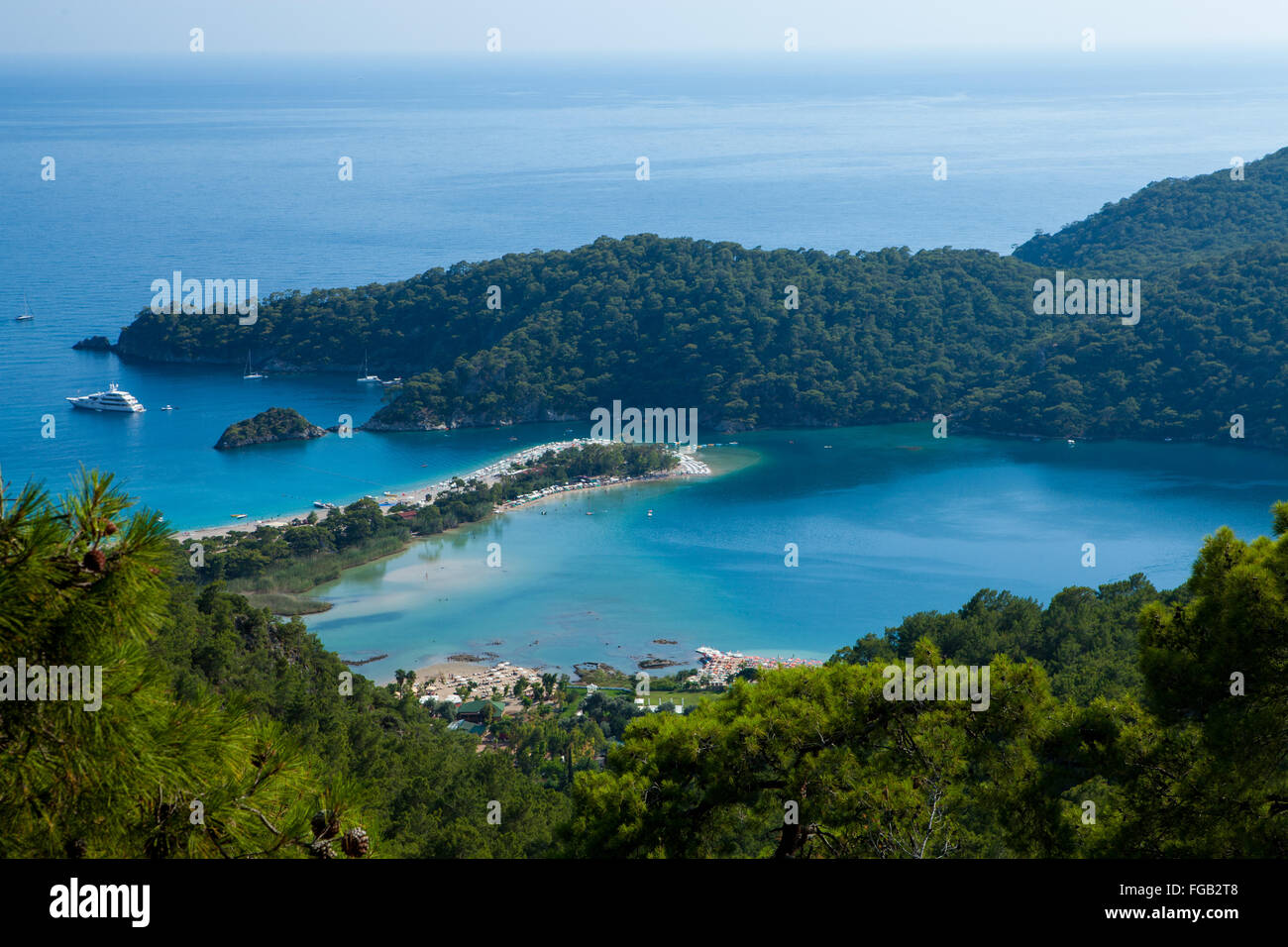 An aerial shot through the pine trees of the blue lagoon, Olu Deniz Turkey Stock Photo