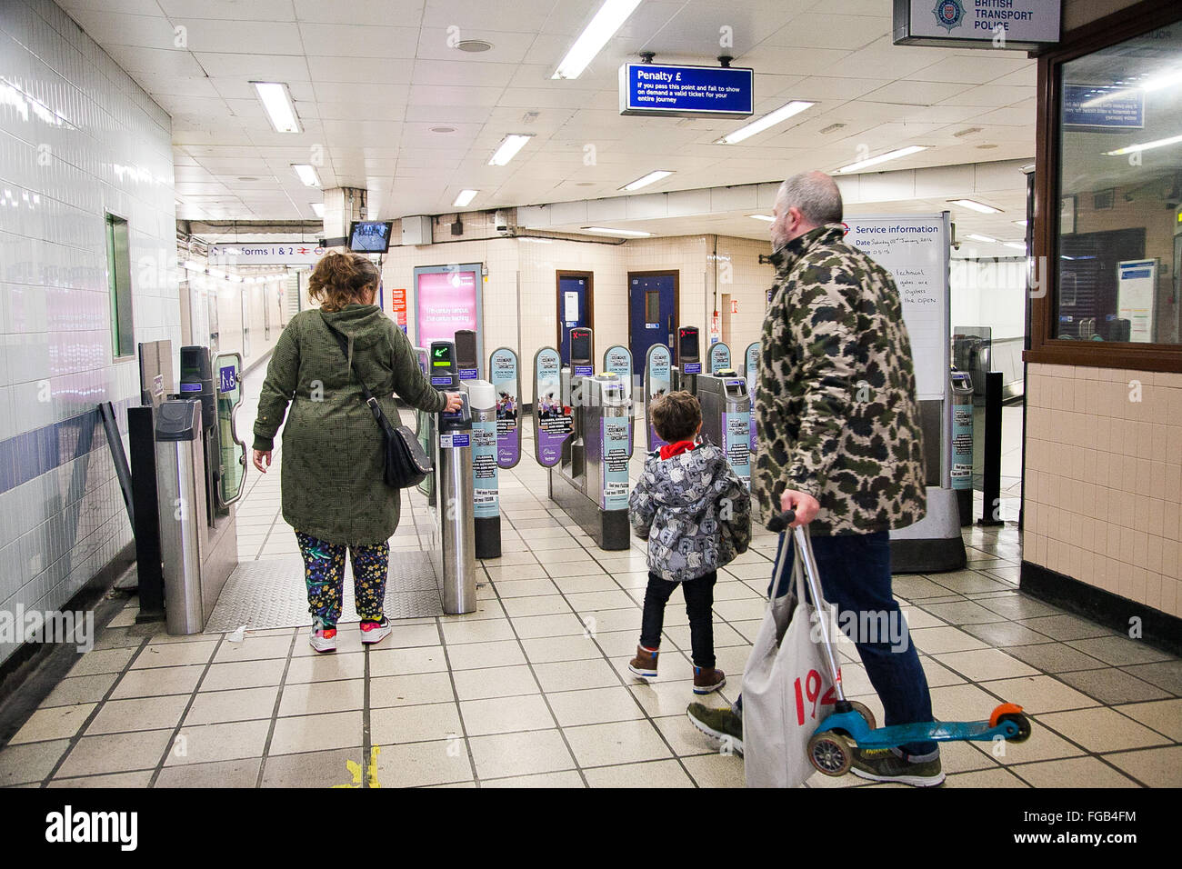 Commuters at ticket barrier at Seven Sister Underground tube station in North London Stock Photo